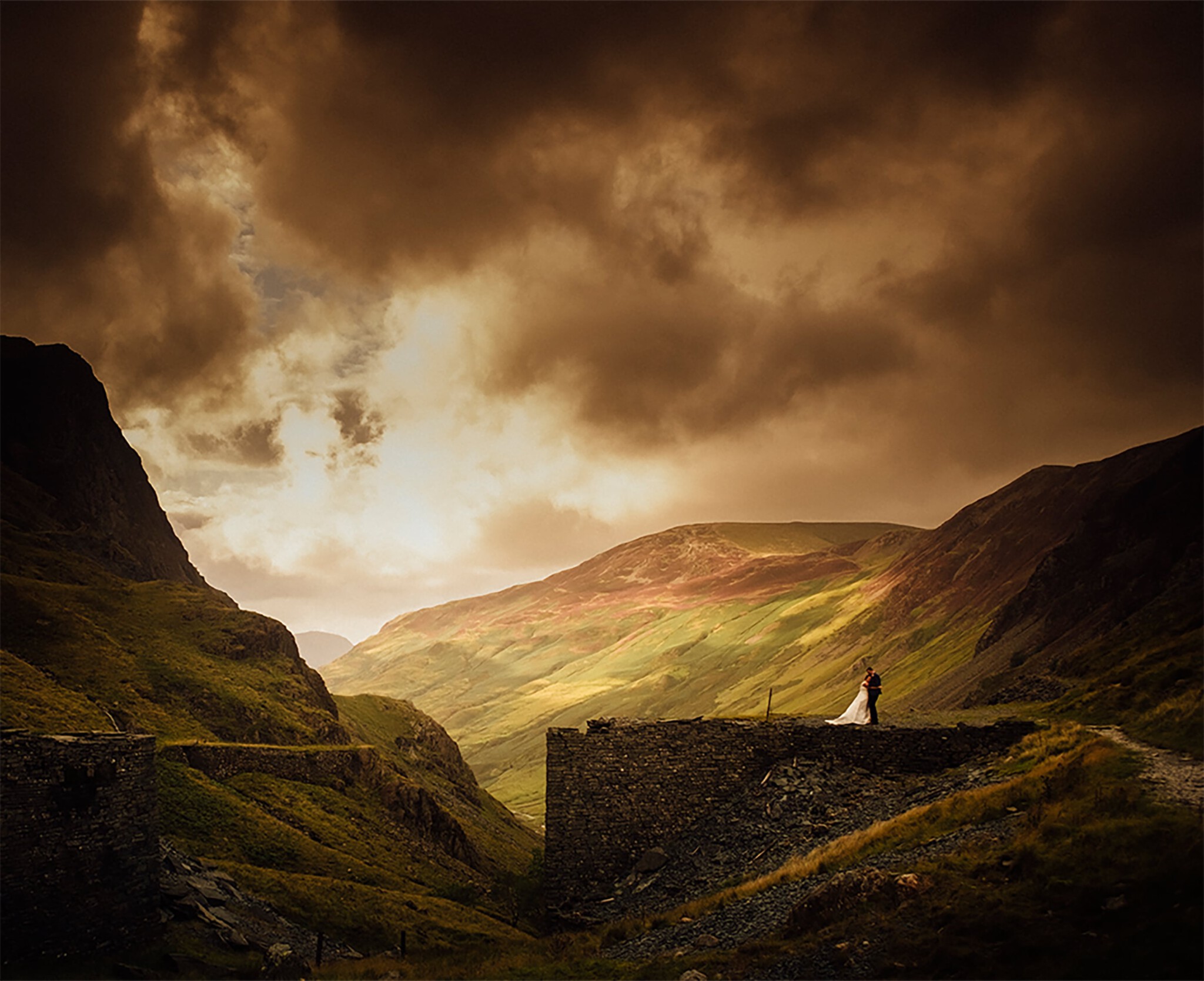 Couple on dramtic hillside
